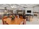 Open living room, kitchen and dining room area with fireplace and coffered ceilings at 6315 Carol Butte Ct, Las Vegas, NV 89141
