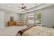 Bright main bedroom featuring large windows and a ceiling fan at 6315 Carol Butte Ct, Las Vegas, NV 89141