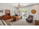 Spacious office with built-in cabinets, a ceiling fan, and sliding doors to the outside at 6315 Carol Butte Ct, Las Vegas, NV 89141