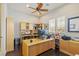 Home office featuring a large desk, built-in bookshelves, and lots of natural light at 6315 Carol Butte Ct, Las Vegas, NV 89141