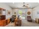 Large office space featuring a wooden desk, plush chair, and sliding glass doors at 6315 Carol Butte Ct, Las Vegas, NV 89141