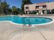 Community pool with a clear, blue water and a view of the surrounding complex at 6441 Brushwood Ln, Las Vegas, NV 89107