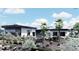 Contemporary home with xeriscaping and black trim at 645 Dragon Peak Dr, Henderson, NV 89012