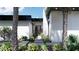 Modern home entrance with sleek black trim and lush landscaping at 645 Dragon Peak Dr, Henderson, NV 89012
