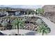 Modern home with desert landscaping, circular driveway and palms at 645 Dragon Peak Dr, Henderson, NV 89012
