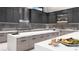 Modern kitchen with stainless steel appliances and quartz countertops at 645 Dragon Peak Dr, Henderson, NV 89012