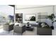 Modern living room with stylish seating, a large window view, and built-in shelving at 645 Dragon Peak Dr, Henderson, NV 89012
