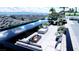 Inviting pool area with stunning views, comfortable seating, and elegant landscaping at 645 Dragon Peak Dr, Henderson, NV 89012