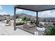 Rooftop deck with stylish seating, outdoor dining, and mountain views at 645 Dragon Peak Dr, Henderson, NV 89012