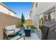 Cozy backyard features seating around a fire pit and a covered outdoor kitchen at 6964 Caldera St, Las Vegas, NV 89149