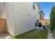 A cozy backyard patio features a grill, outdoor seating, and low maintenance artificial turf at 6964 Caldera St, Las Vegas, NV 89149