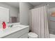 Clean bathroom features a modern vanity, a large mirror, and a shower with a stylish shower curtain at 6964 Caldera St, Las Vegas, NV 89149