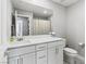 Bathroom features a white vanity with quartz countertop and modern fixtures at 6964 Caldera St, Las Vegas, NV 89149