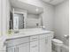 Bathroom features a white vanity with quartz countertop and modern fixtures at 6964 Caldera St, Las Vegas, NV 89149