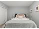 Bright bedroom featuring neutral walls, a plush bed with decorative pillows, and a closet at 6964 Caldera St, Las Vegas, NV 89149