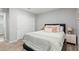 Cozy bedroom featuring carpet, closet and a comfortable bed with decorative pillows and bedside tables at 6964 Caldera St, Las Vegas, NV 89149