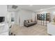 This bonus room features neutral tones and a comfortable gray sofa at 6964 Caldera St, Las Vegas, NV 89149