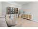 Bonus room displays a gray sofa, modern cabinet, and stylish decor at 6964 Caldera St, Las Vegas, NV 89149