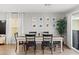 Stylish dining room with modern table, chairs, and curated wall art creating an inviting space at 6964 Caldera St, Las Vegas, NV 89149