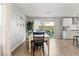 Bright dining room with hardwood floors, modern decor, and access to the outdoor patio at 6964 Caldera St, Las Vegas, NV 89149