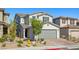 Charming two-story home featuring a neutral exterior, well-kept landscaping, and a two-car garage at 6964 Caldera St, Las Vegas, NV 89149