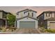 Inviting exterior of a two-story home with a neatly paved driveway leading to an attached two-car garage at 6964 Caldera St, Las Vegas, NV 89149