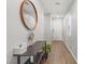 Hallway featuring wood floors, a decorative mirror, and a stylish console table with decor at 6964 Caldera St, Las Vegas, NV 89149