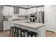 Modern kitchen featuring stainless steel appliances, granite countertops, and an island with barstool seating at 6964 Caldera St, Las Vegas, NV 89149