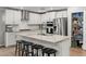Well-equipped kitchen boasts stainless steel appliances, granite counters, pantry and ample storage at 6964 Caldera St, Las Vegas, NV 89149