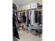 Spacious walk-in closet offers ample storage with clothing racks, shelves, and shoe storage at 6964 Caldera St, Las Vegas, NV 89149