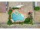 Aerial view of the backyard oasis with a pool, spa, waterfall, and lush greenery at 703 Jane Eyre Pl, Henderson, NV 89002