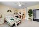 Cozy bedroom with a decorative fireplace, comfortable bedding, and an ensuite bathroom entrance at 703 Jane Eyre Pl, Henderson, NV 89002