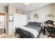 Inviting bedroom with dark furnishings, a well-lit vanity, and a tidy workspace at 703 Jane Eyre Pl, Henderson, NV 89002