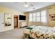 Bright bedroom featuring floral bedding, plantation shutters, and a large closet with ample storage at 703 Jane Eyre Pl, Henderson, NV 89002