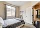 Bedroom features natural light, carpet flooring, and modern decor at 703 Jane Eyre Pl, Henderson, NV 89002