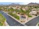Community park featuring play equipment, walking paths and palm trees, against a mountain backdrop at 703 Jane Eyre Pl, Henderson, NV 89002