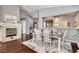 Elegant dining room featuring a fireplace and hardwood floors at 703 Jane Eyre Pl, Henderson, NV 89002