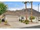 Single-story home features a two car garage, desert landscaping, tiled roof, and a mountain backdrop at 703 Jane Eyre Pl, Henderson, NV 89002