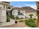 Charming single-story home featuring desert landscaping and a tiled roof with a mountain backdrop at 703 Jane Eyre Pl, Henderson, NV 89002