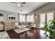 Comfortable living room with hardwood floors, natural light, and access to outdoor area at 703 Jane Eyre Pl, Henderson, NV 89002