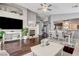 Inviting living room with fireplace, hardwood floors, and dining area access at 703 Jane Eyre Pl, Henderson, NV 89002