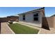 View of backyard featuring artificial turf, patio, and barbecue area at 739 Wild Highlands Ln, Henderson, NV 89015