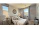 Stylishly decorated bedroom with a comfortable bed, modern decor, and plenty of natural light at 739 Wild Highlands Ln, Henderson, NV 89015