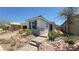 Charming single-story home featuring desert landscaping and inviting walkway at 739 Wild Highlands Ln, Henderson, NV 89015