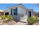Charming single-story home with a well-manicured front yard and inviting walkway at 739 Wild Highlands Ln, Henderson, NV 89015