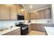 Well-appointed kitchen features stainless steel appliances, quartz countertops, and plenty of storage space at 739 Wild Highlands Ln, Henderson, NV 89015