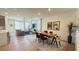 Bright, open-concept living and dining area with hardwood floors and lots of natural light at 739 Wild Highlands Ln, Henderson, NV 89015
