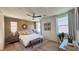 Serene primary bedroom with a ceiling fan, neutral decor, and lots of natural light at 739 Wild Highlands Ln, Henderson, NV 89015