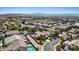 Aerial view of a residential neighborhood showcasing manicured landscaping and community pools at 741 Wildwood Beach Ave, Henderson, NV 89052