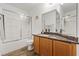Bathroom with granite countertop and shower-tub combo at 741 Wildwood Beach Ave, Henderson, NV 89052
